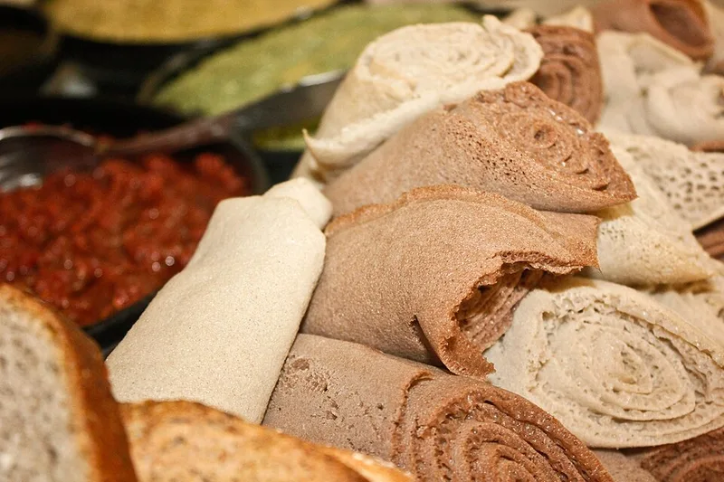 Fit-fit (Eritrean Shredded Injera Breakfast), via Wikimedia Commons