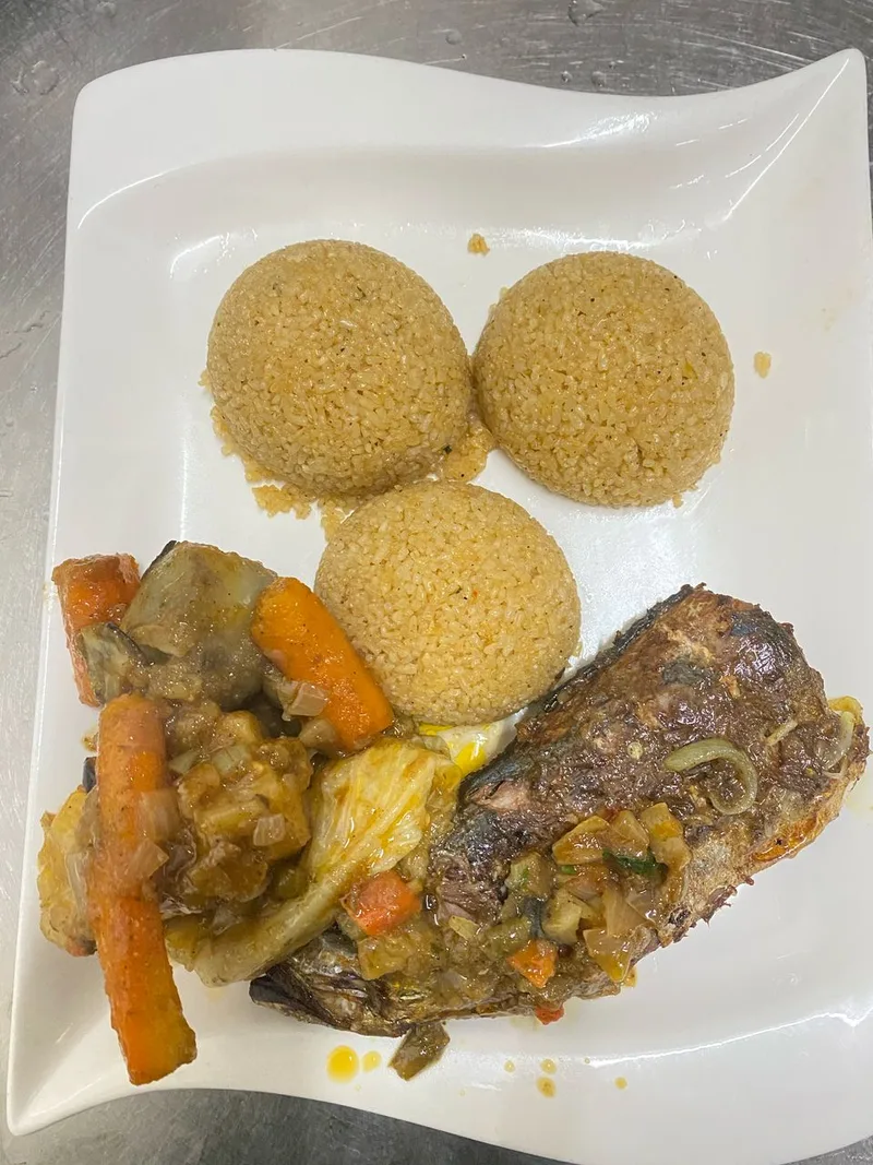 Poisson Braisé (Grilled Tilapia), via Wikimedia Commons